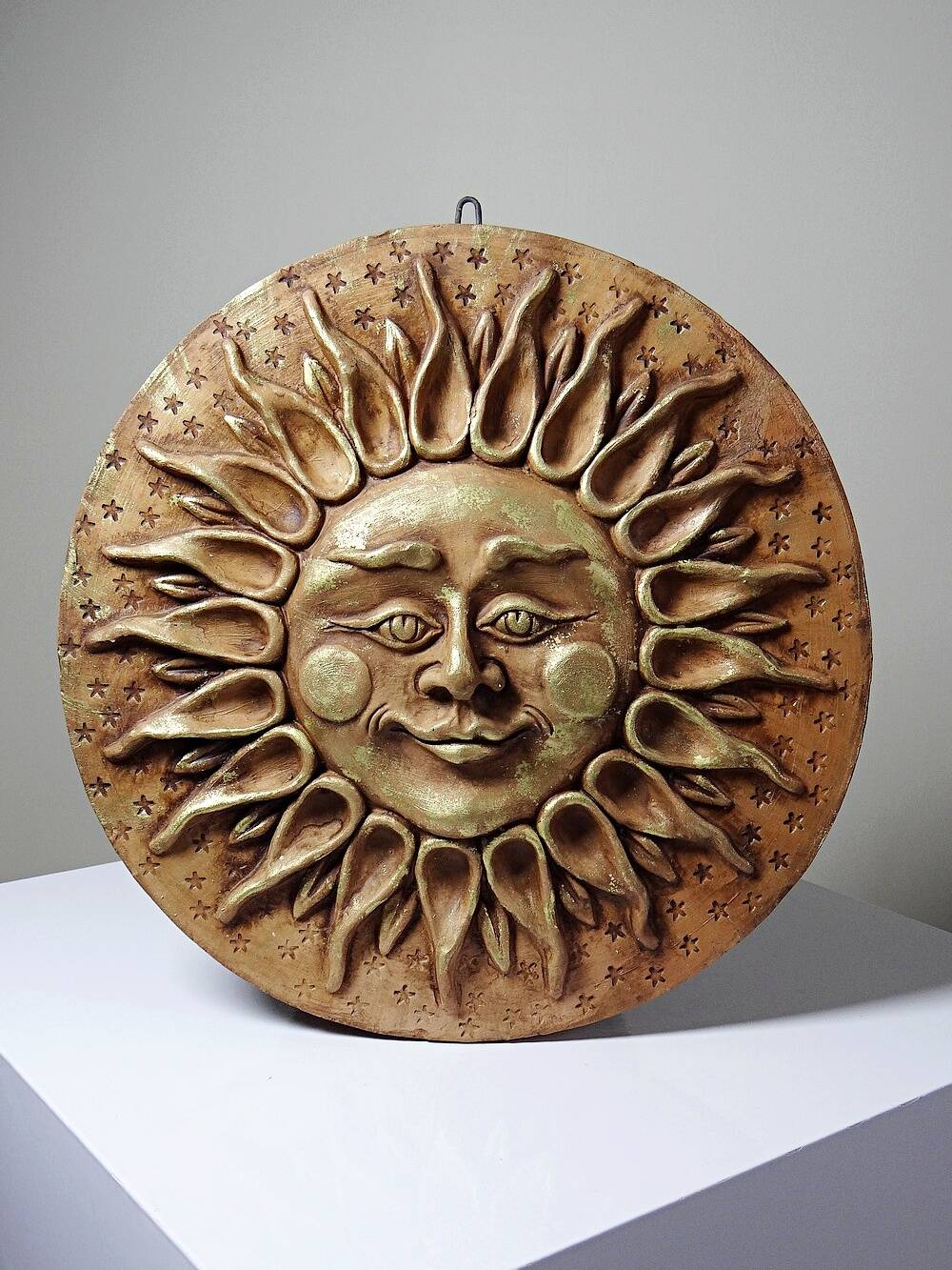 Anthropomorphic sun wall sculpture in patinated terracotta, vintage Italian craftsmanship.