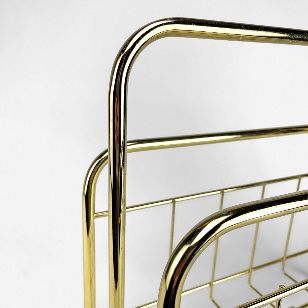 Graphic magazine holder in golden brass 70s