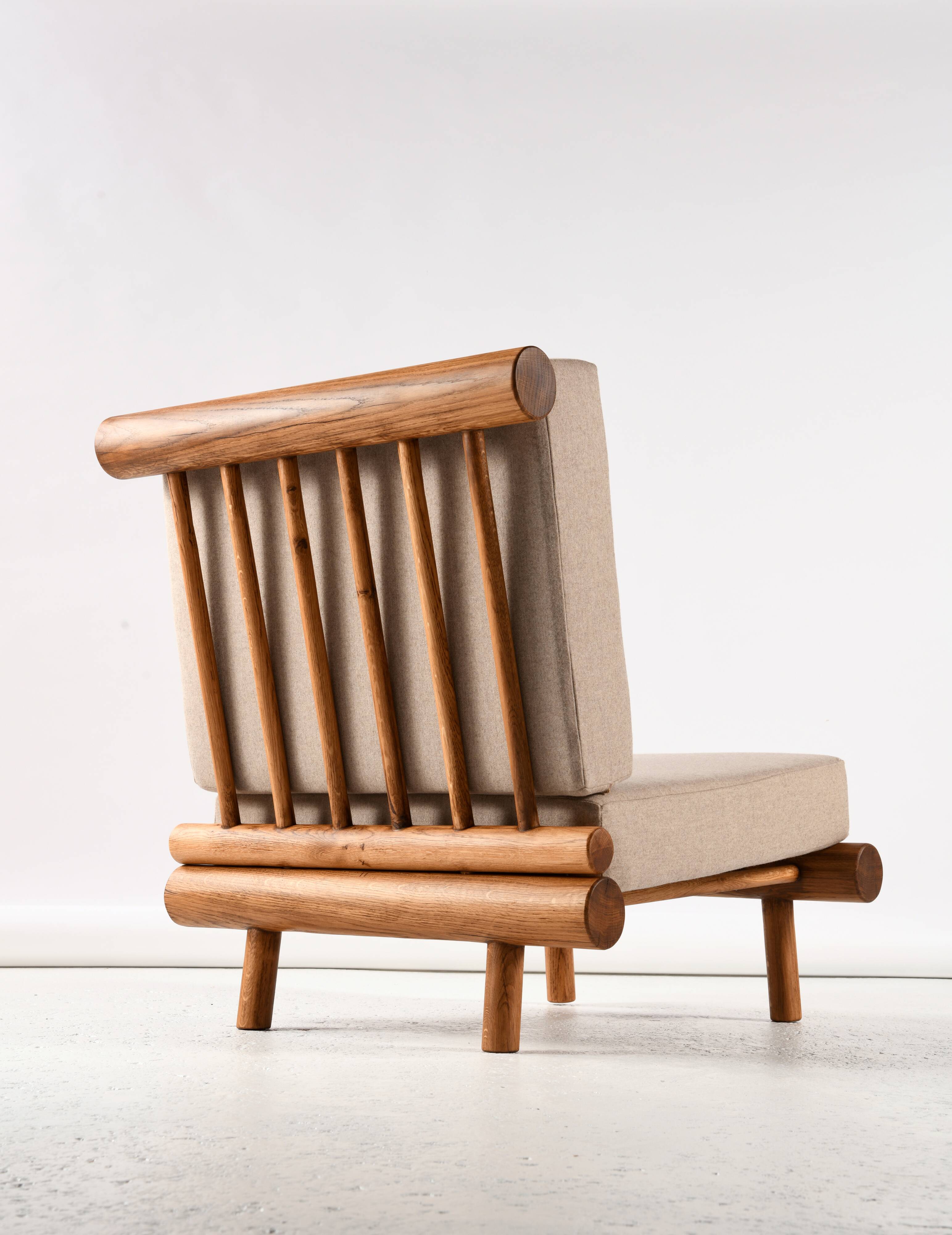 Pair of low chairs called La cachette selected by Charlotte Perriand