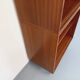 Vintage wooden bookshelf in teak style from the 1960s.