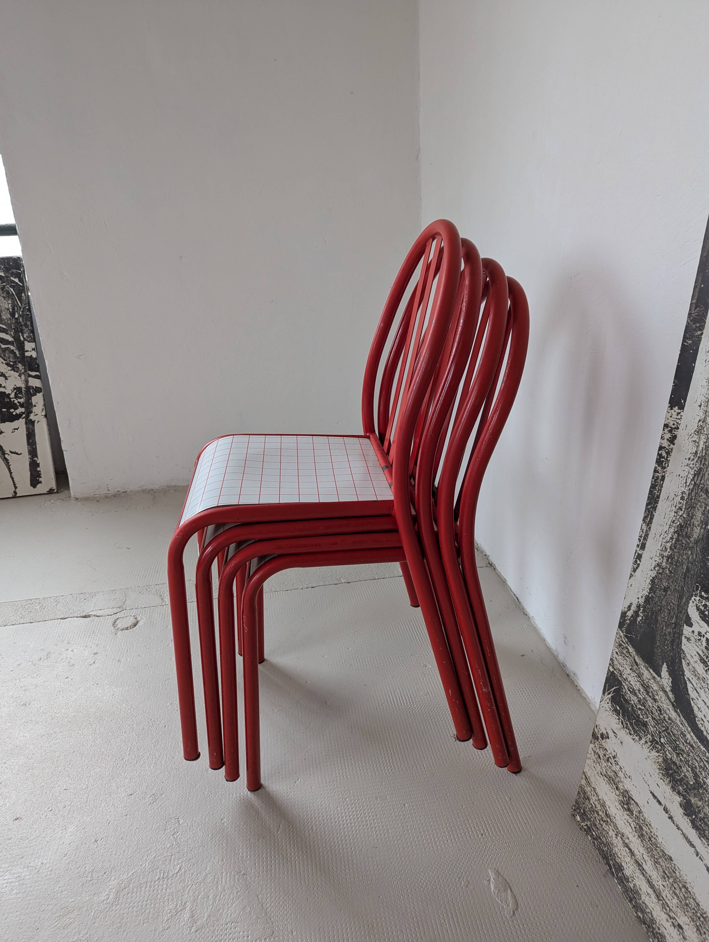 Set of 4 modernist red metal chairs
