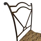 Wrought iron chair with woven seat