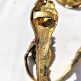 Old curtain kiss in gilded bronze