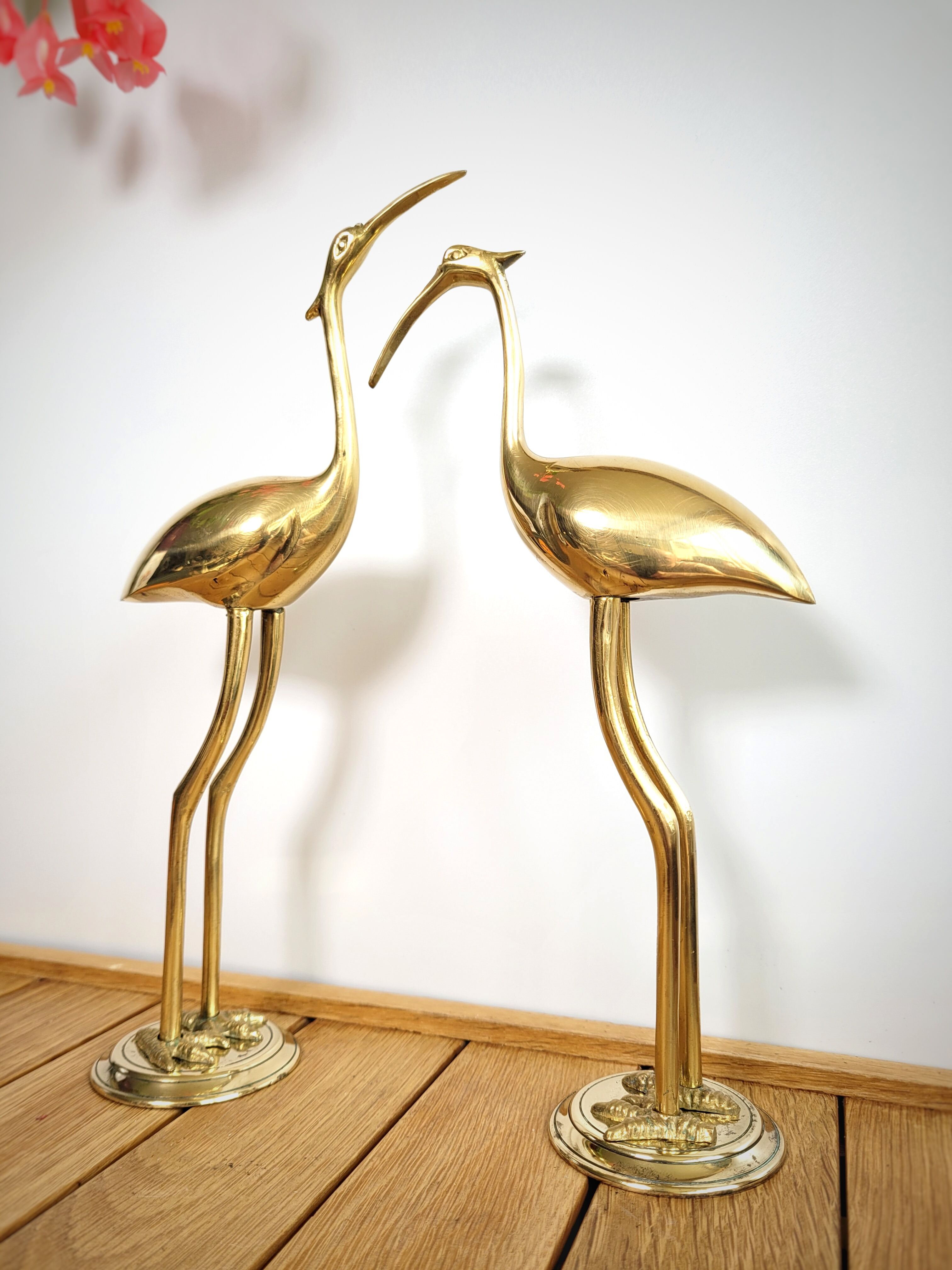 Duo of brass herons