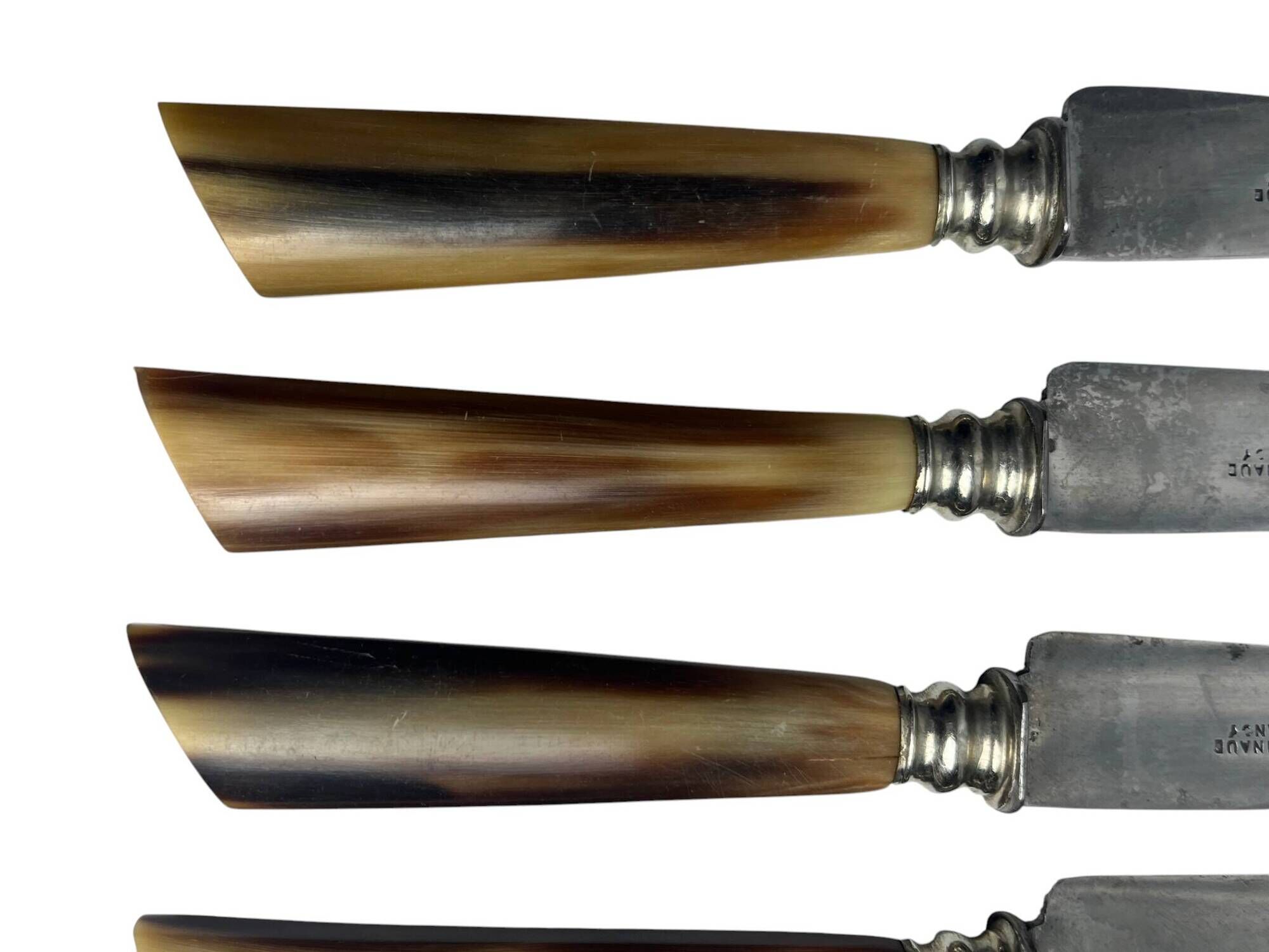Six knives with steel blades and horn handles, Bonnaud Nancy, early 20th century.