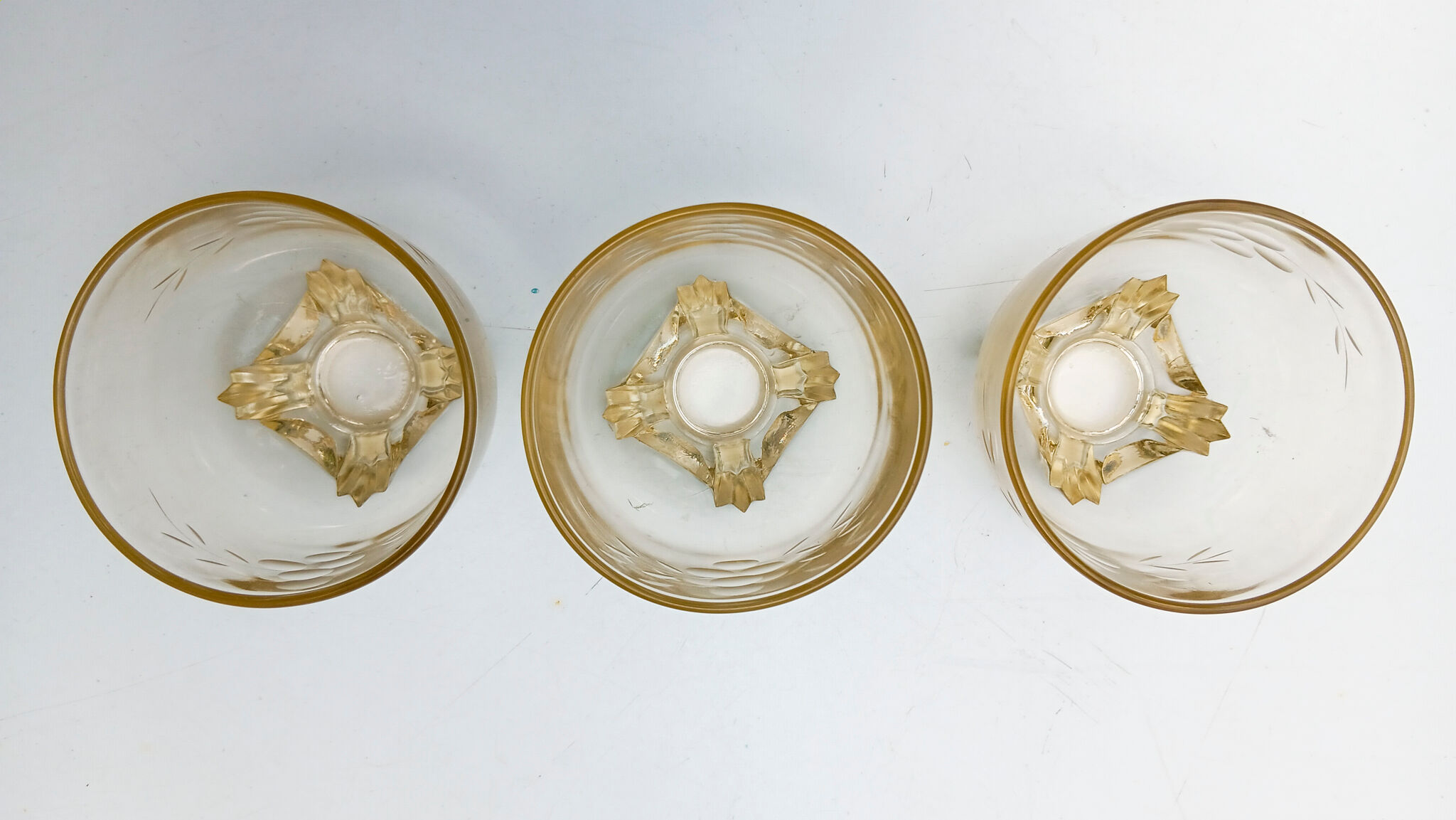 3 low glasses on Art Deco stand