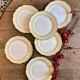 Set of 6 vintage white dinner plates with yellow and gold trim.