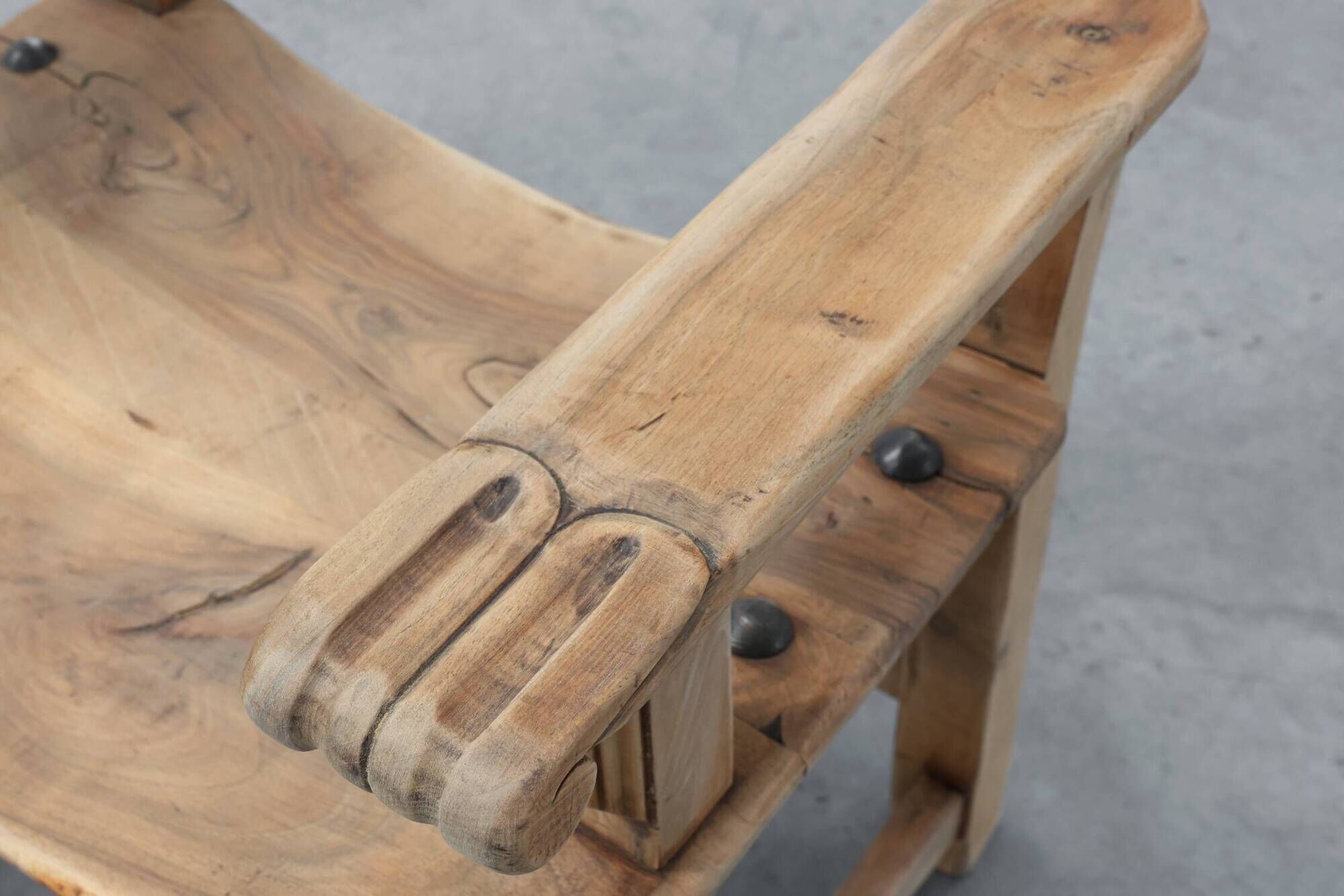 Brutalist armchair with carved rosettes and nailed wooden seat, Spain