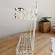 Vintage ivory patinated metal wall shelf