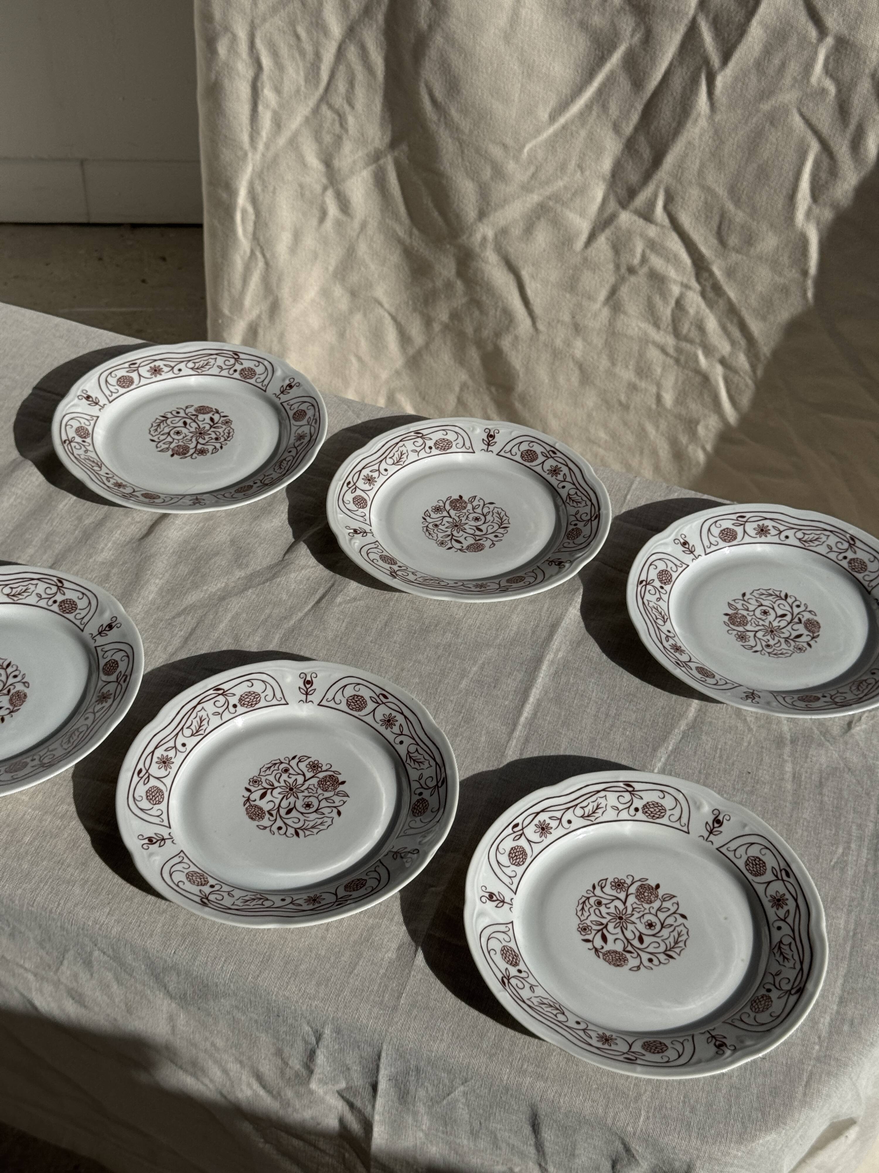 Set of 6 vintage dessert plates made in Poland with a plant motif.
