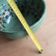 Large glazed ceramic salad bowl with a floral design.
