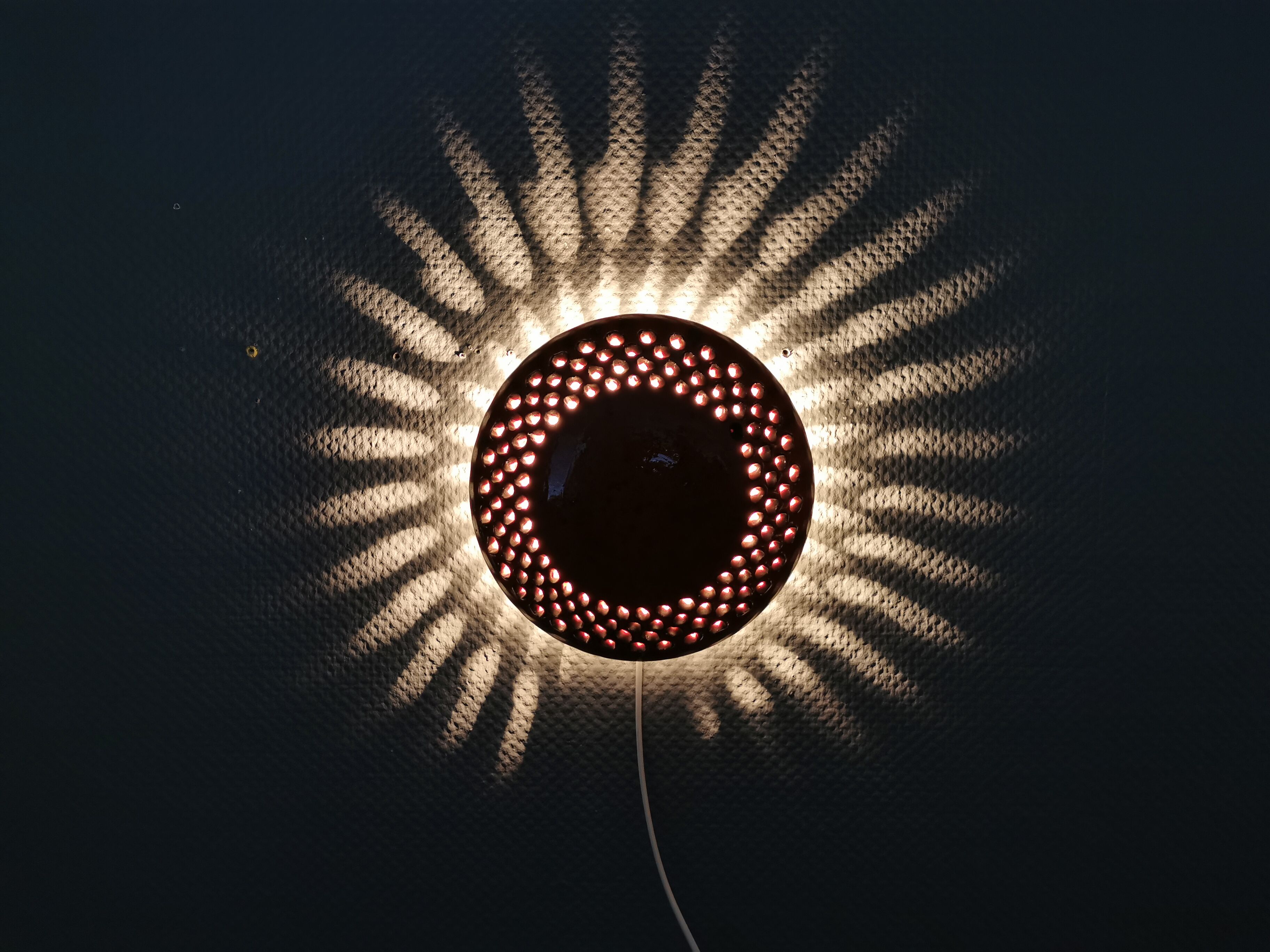 Danish ceramic wall lamp, in nice red glaze. From the 1960s