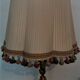 Lampe pied en bronze doré abat jour plissé