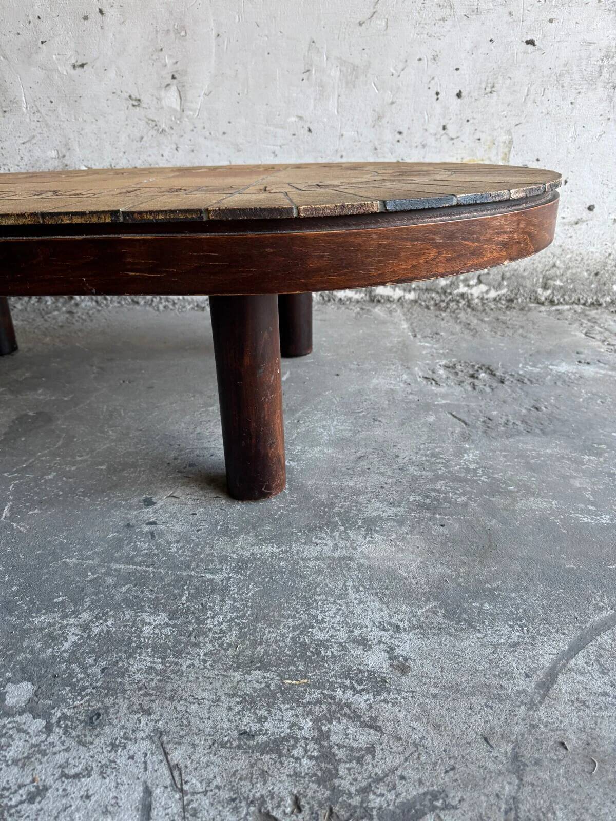 Roger Capron brown-ochre ceramic tile coffee table with wooden base, oval leaf-motif top