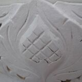 Decorative pediment in white carved wood