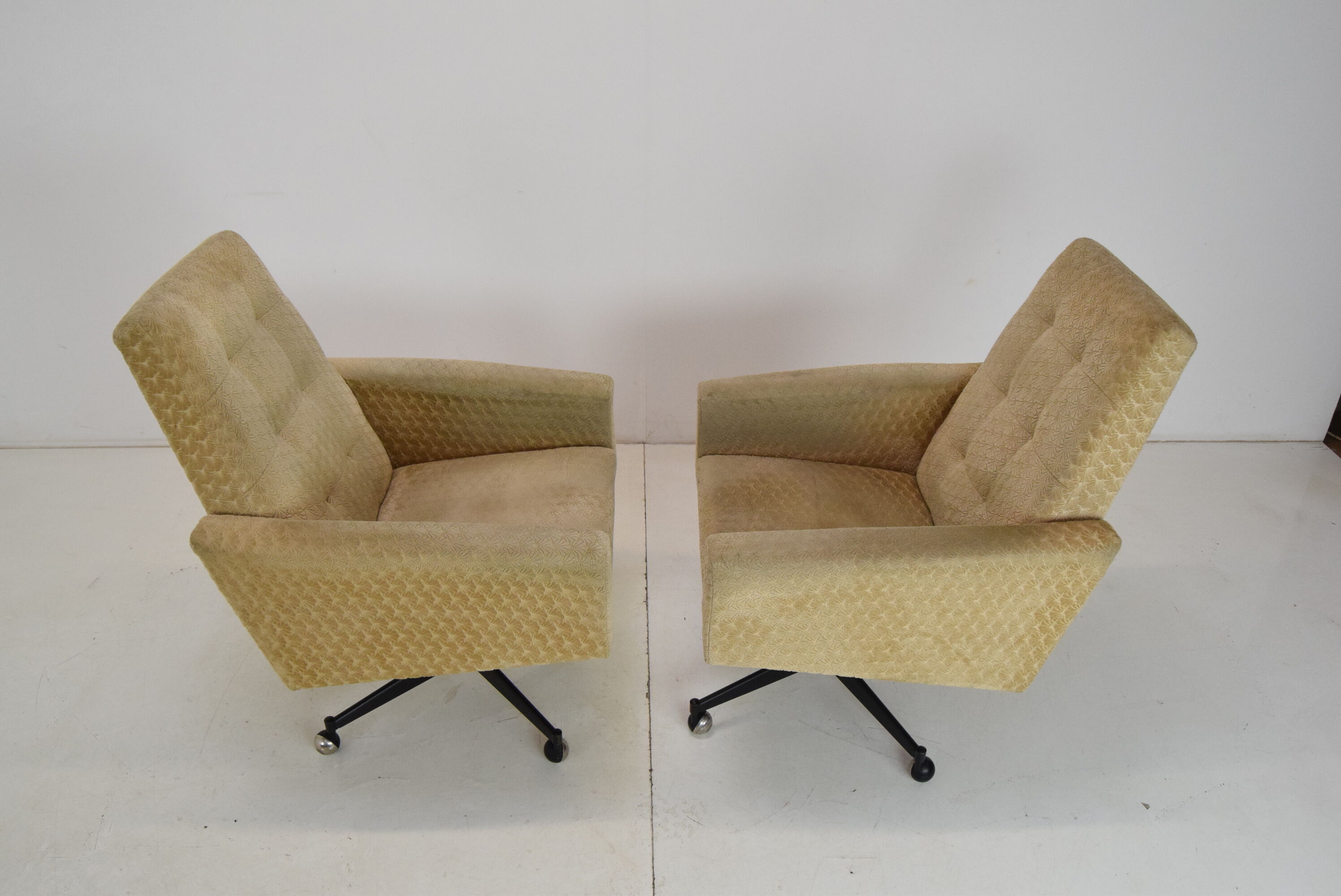 Pair of mid-century swivel armchairs with wheels 1970's