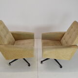 Pair of mid-century swivel armchairs with wheels 1970's
