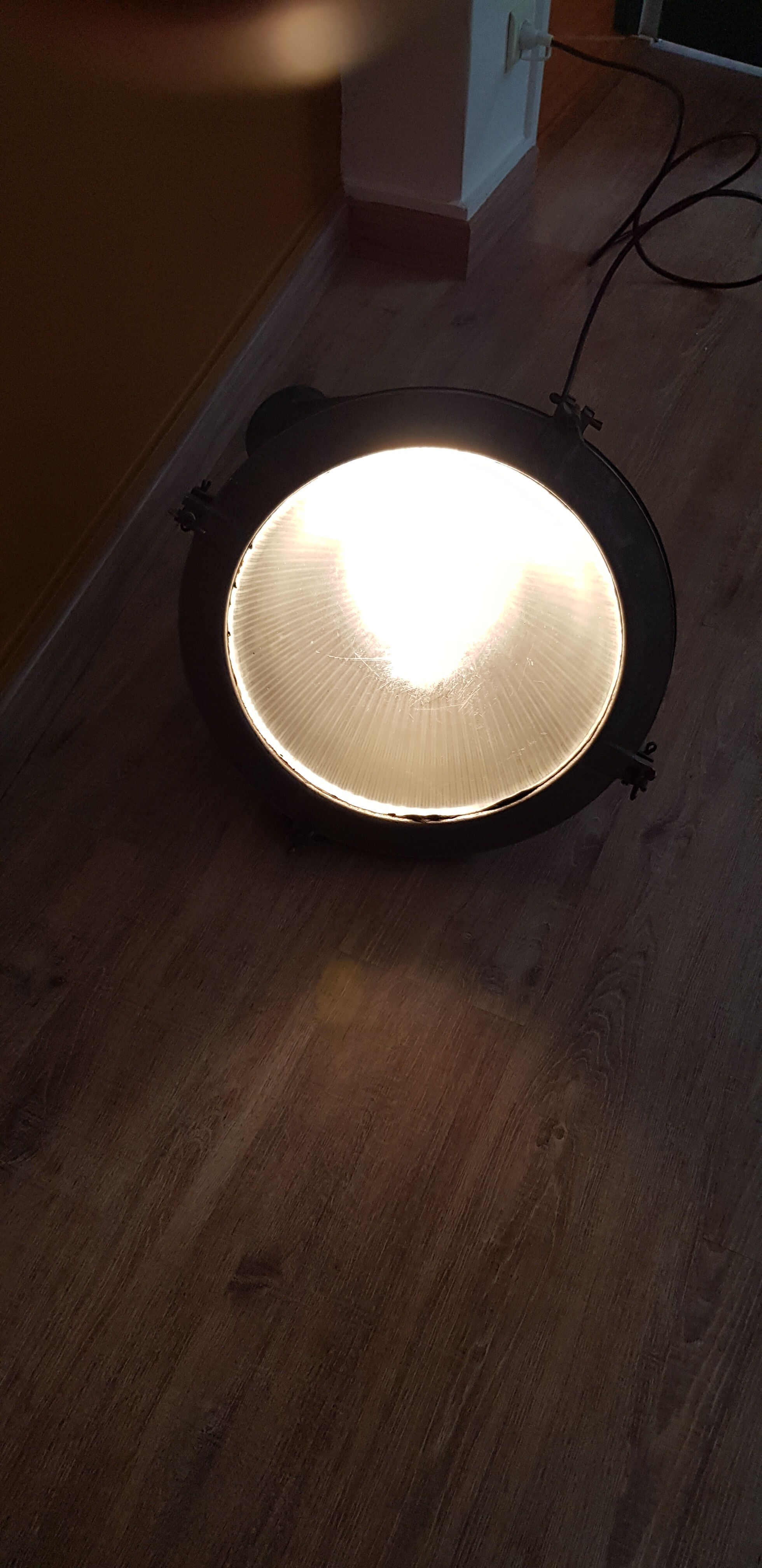 Old brass boat headlight with Holophane interior glass