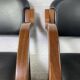 Paire de fauteuils en cuir et bois