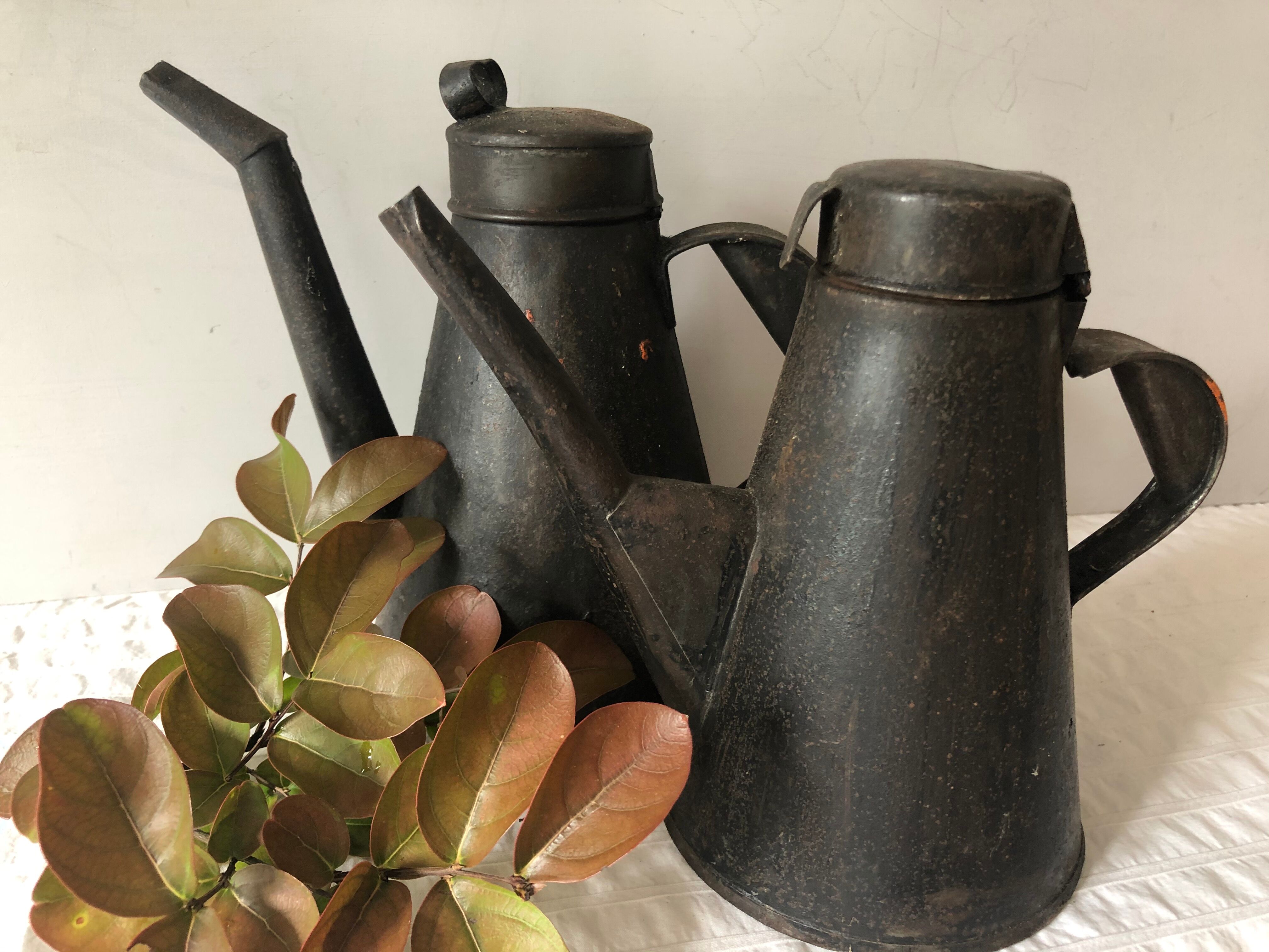 Two workshop burettes, indoor watering cans