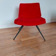 Vintage red faux fur armchair with black metal legs.