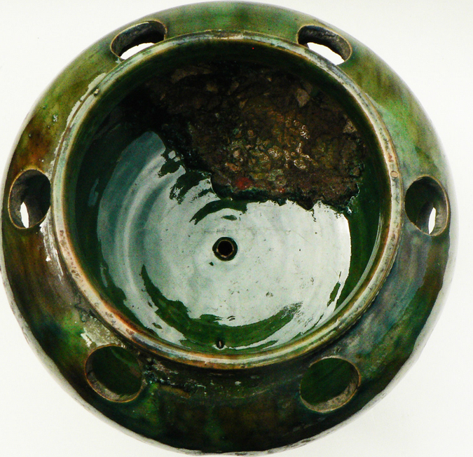 details on old bulb pot in glazed earthenware