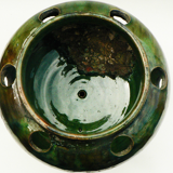 details on old bulb pot in glazed earthenware