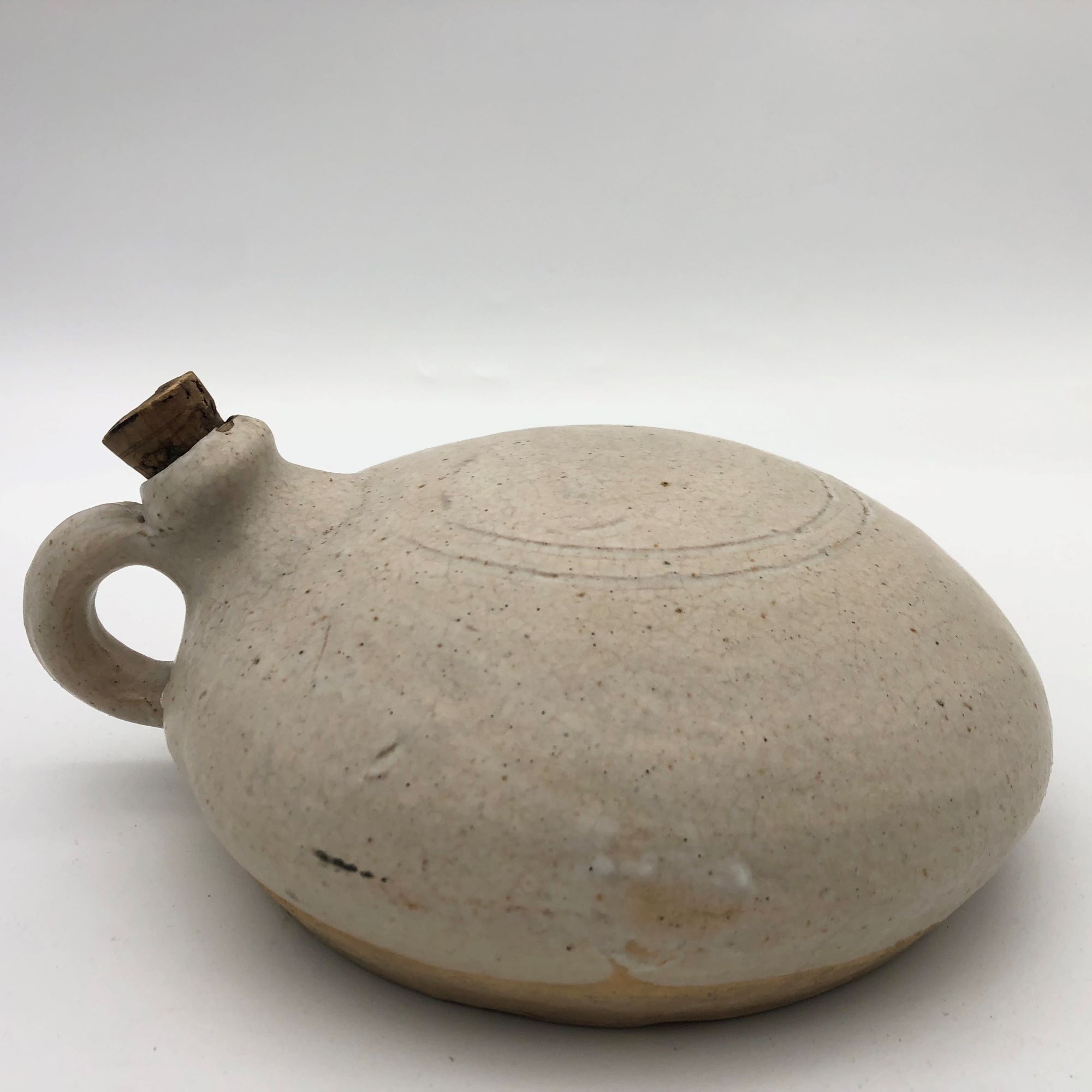 Old round sandstone hot water bottle