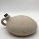 Old round sandstone hot water bottle