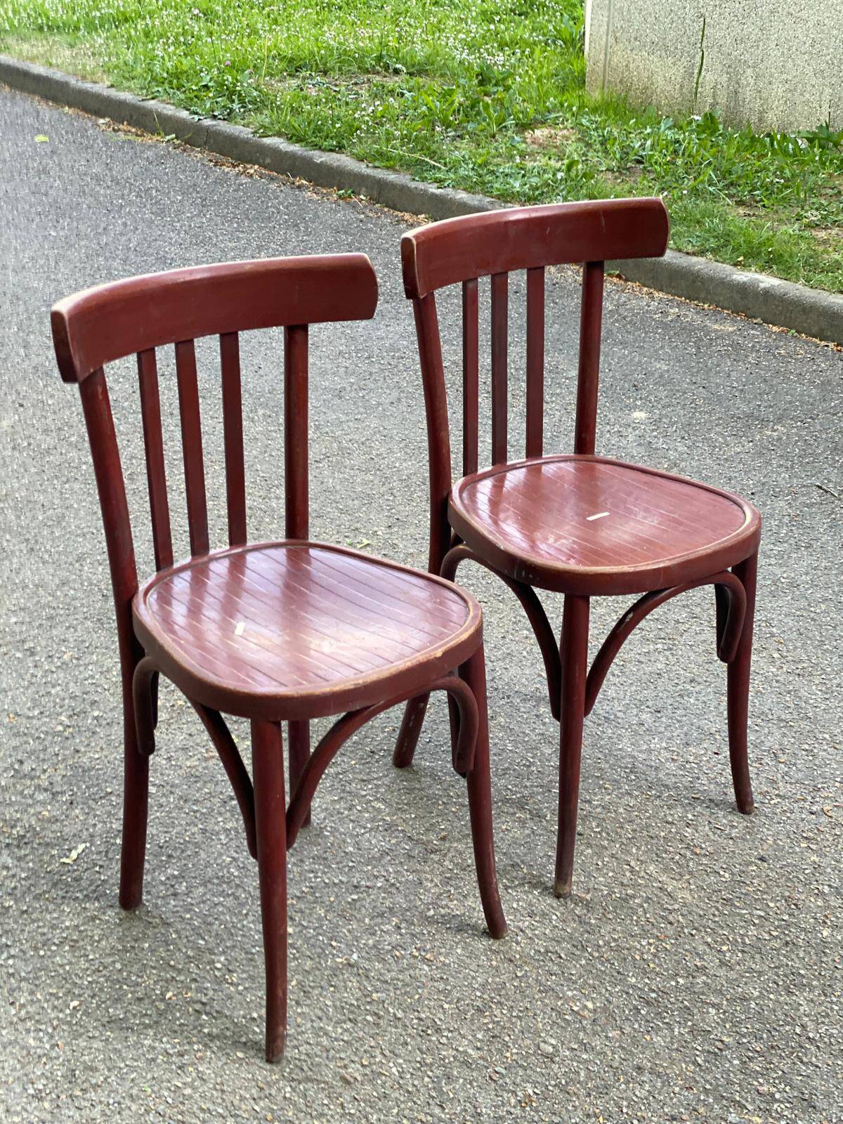 2 burgundy curved wooden bistro chairs from Ets Joseph Levallois