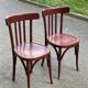 2 burgundy curved wooden bistro chairs from Ets Joseph Levallois