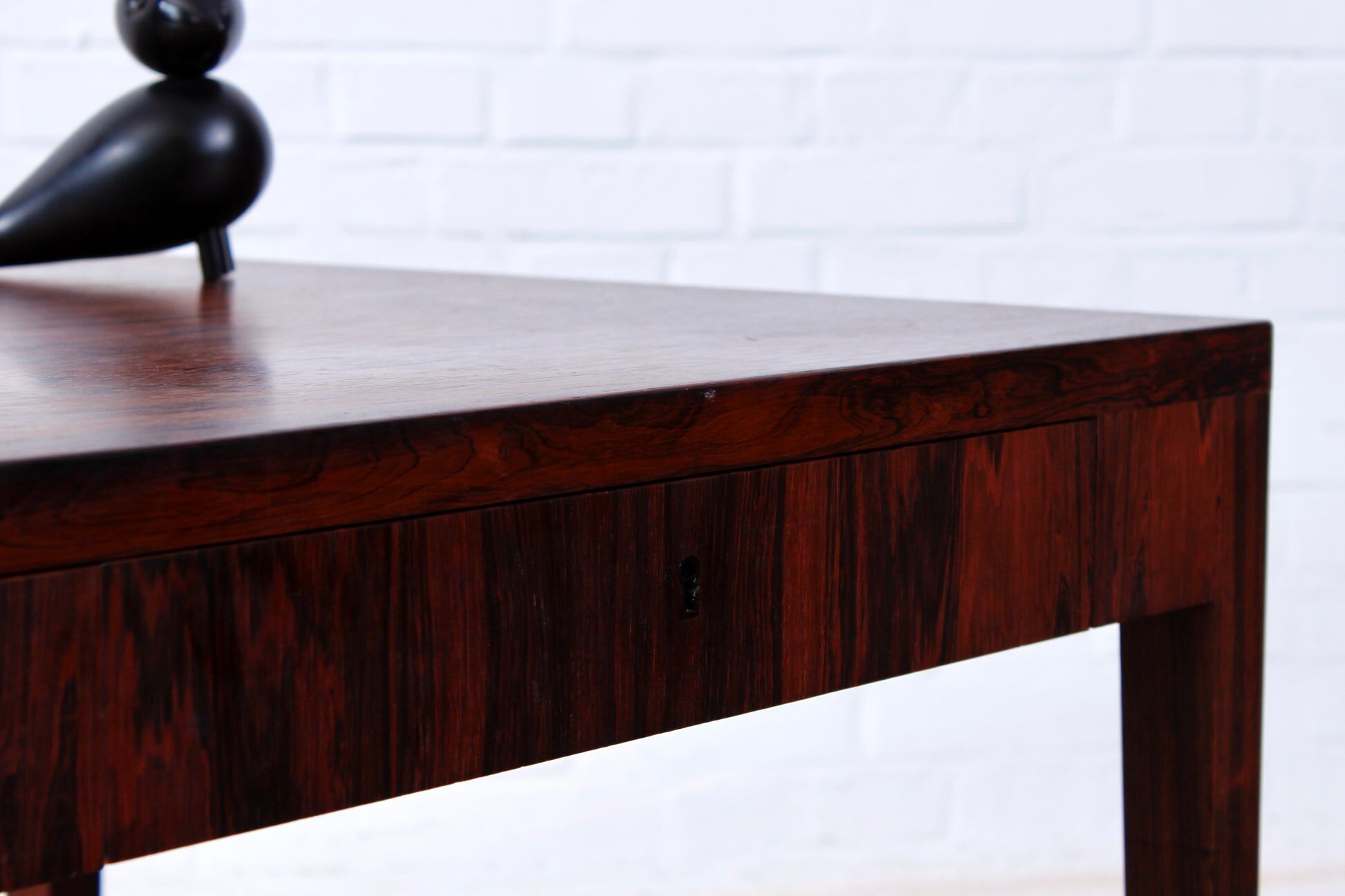 Minimalist rosewood desk by Riis Andersen