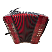 Red Aidi R accordion in his suitcase