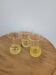 Trio of small yellow granite glasses with gold rims