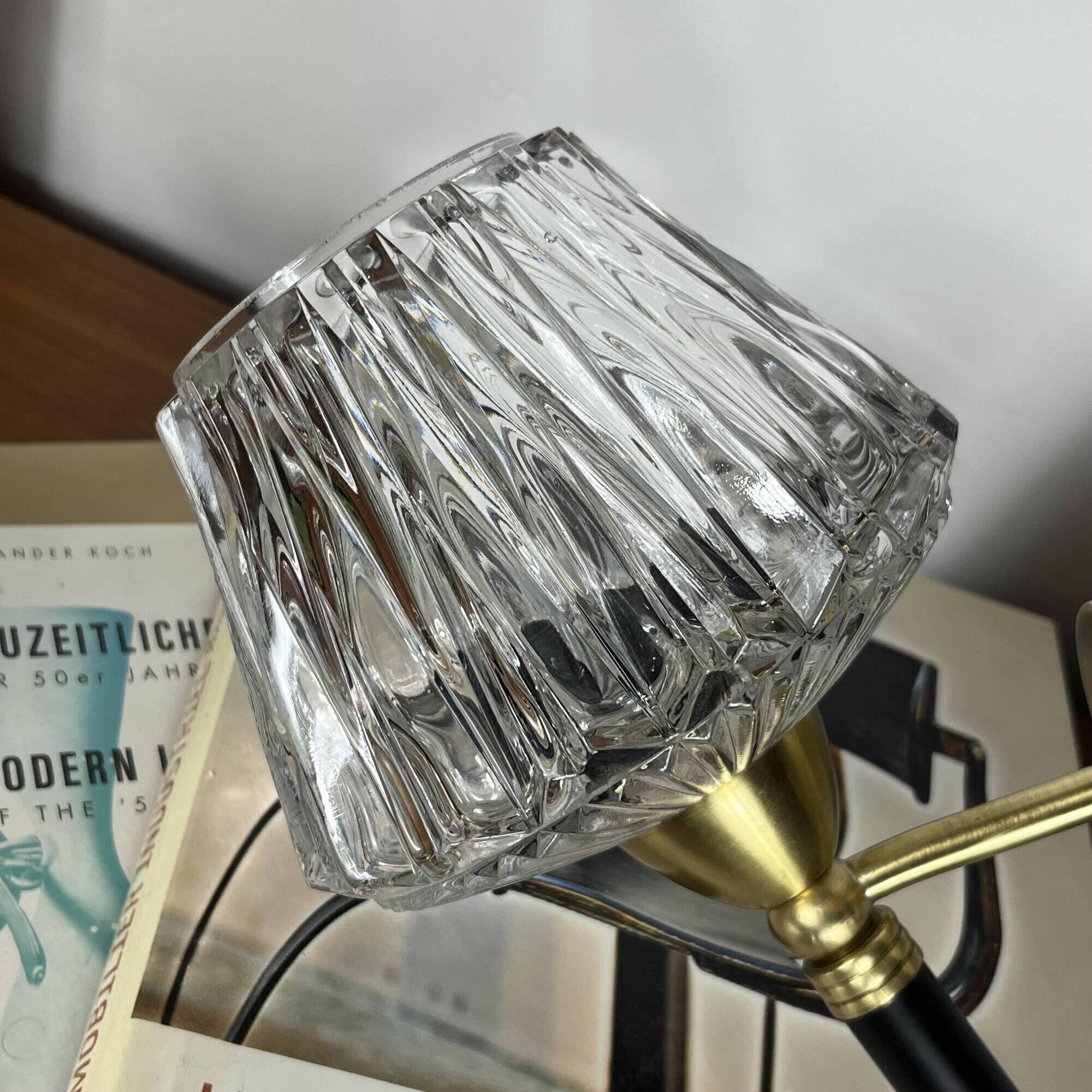 Vintage wall sconce torch in brass, thick glass globes.