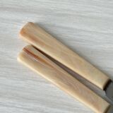 Pink bakelite butter knives.