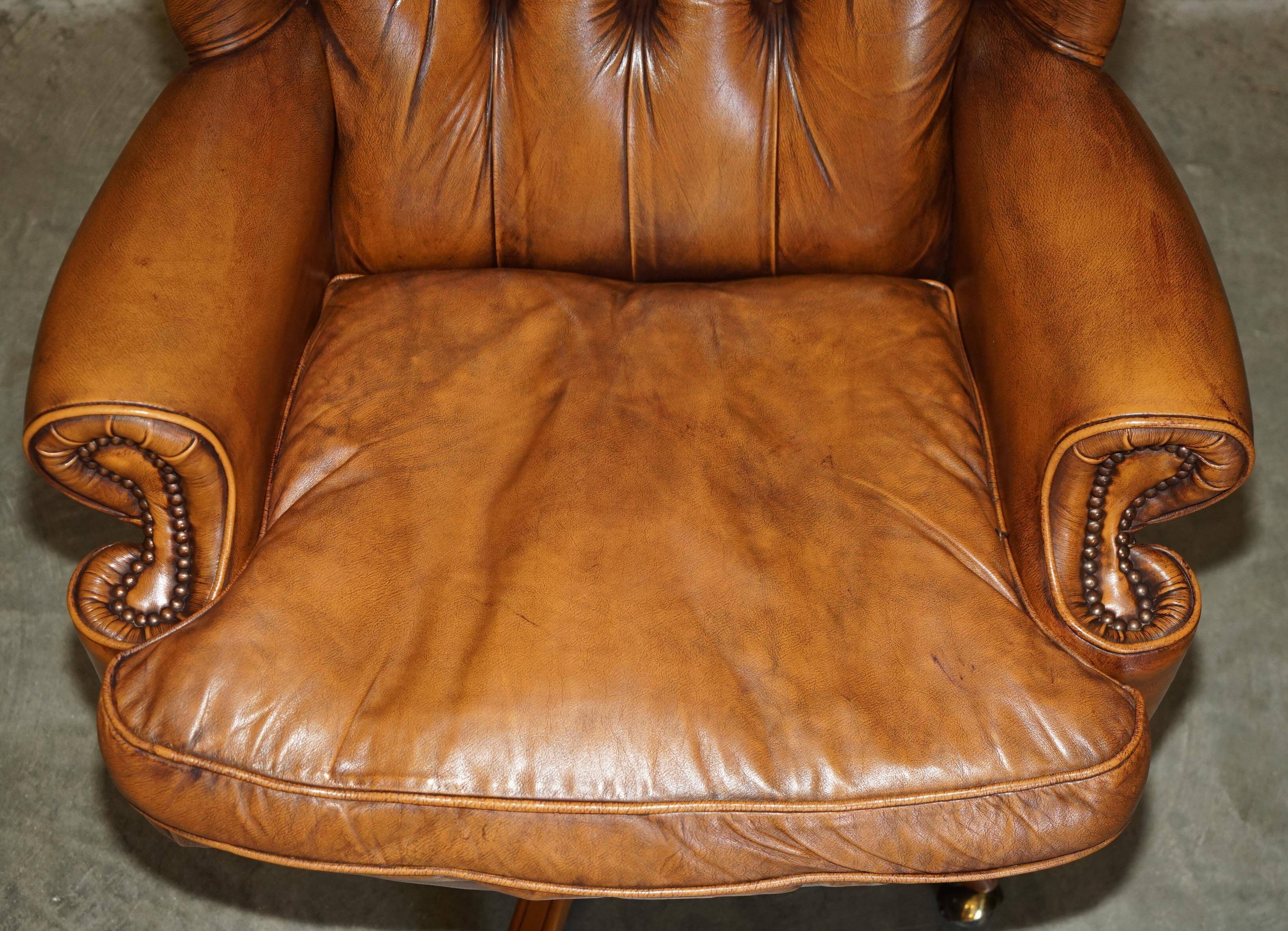 Captain's chair Chesterfield vintage leather with tufted wingback.