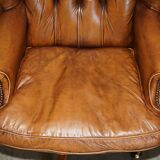 Captain's chair Chesterfield vintage leather with tufted wingback.