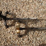 Pair of old chenets fleur de lys pattern