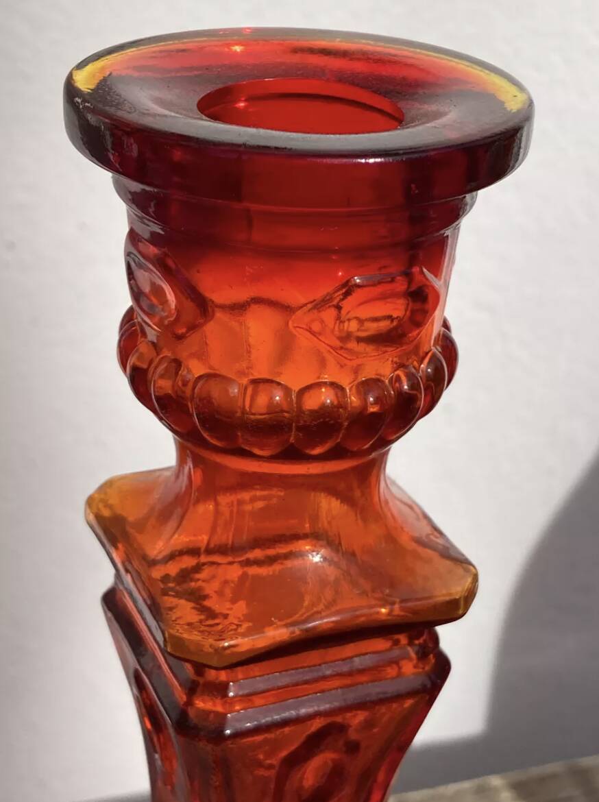 Pair of amber glass candlesticks