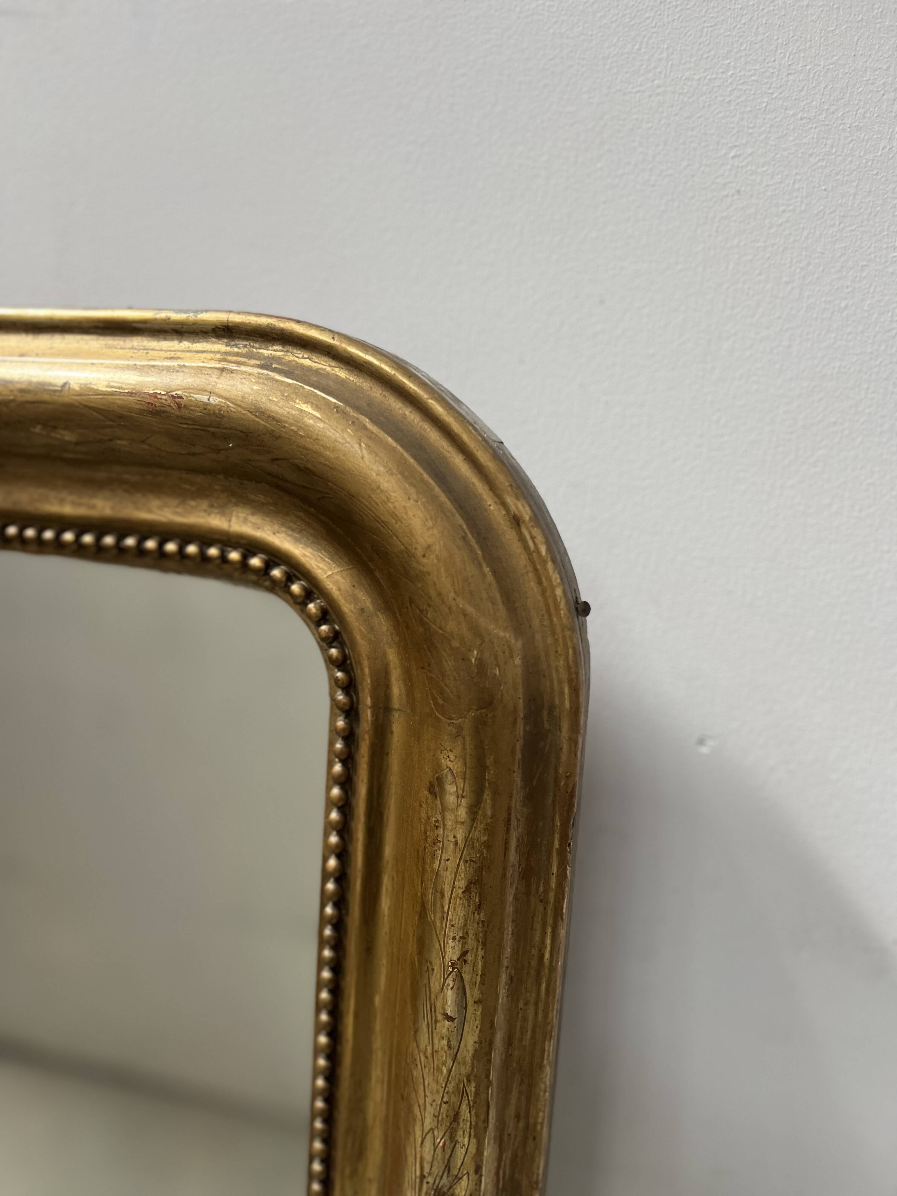 Louis Philippe mirror in wood and gilded stucco, 19th century