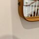 Jacques Adnet mirror covered in cognac leather