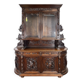 Buffet two-body hunting cabinet in carved oak with glass, in Henri II style.