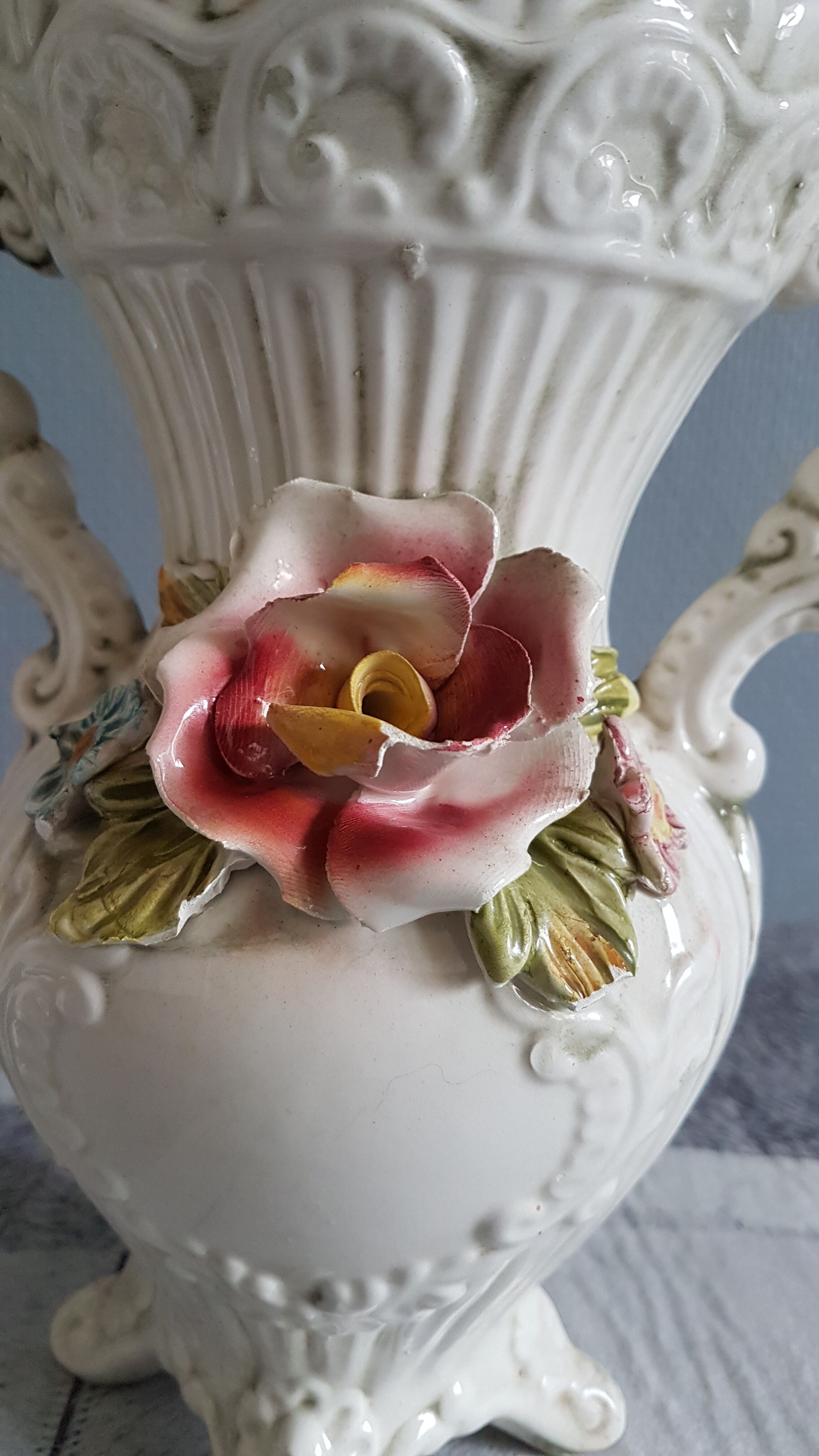 White dabbling vases with capodimonte porcelain floral decoration
