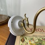 Swan neck wall light in brass with rose petal glass shade.