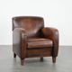 Beautifully shaped vintage sheepskin armchair with character