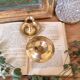 Paire de petits bougeoirs en laiton