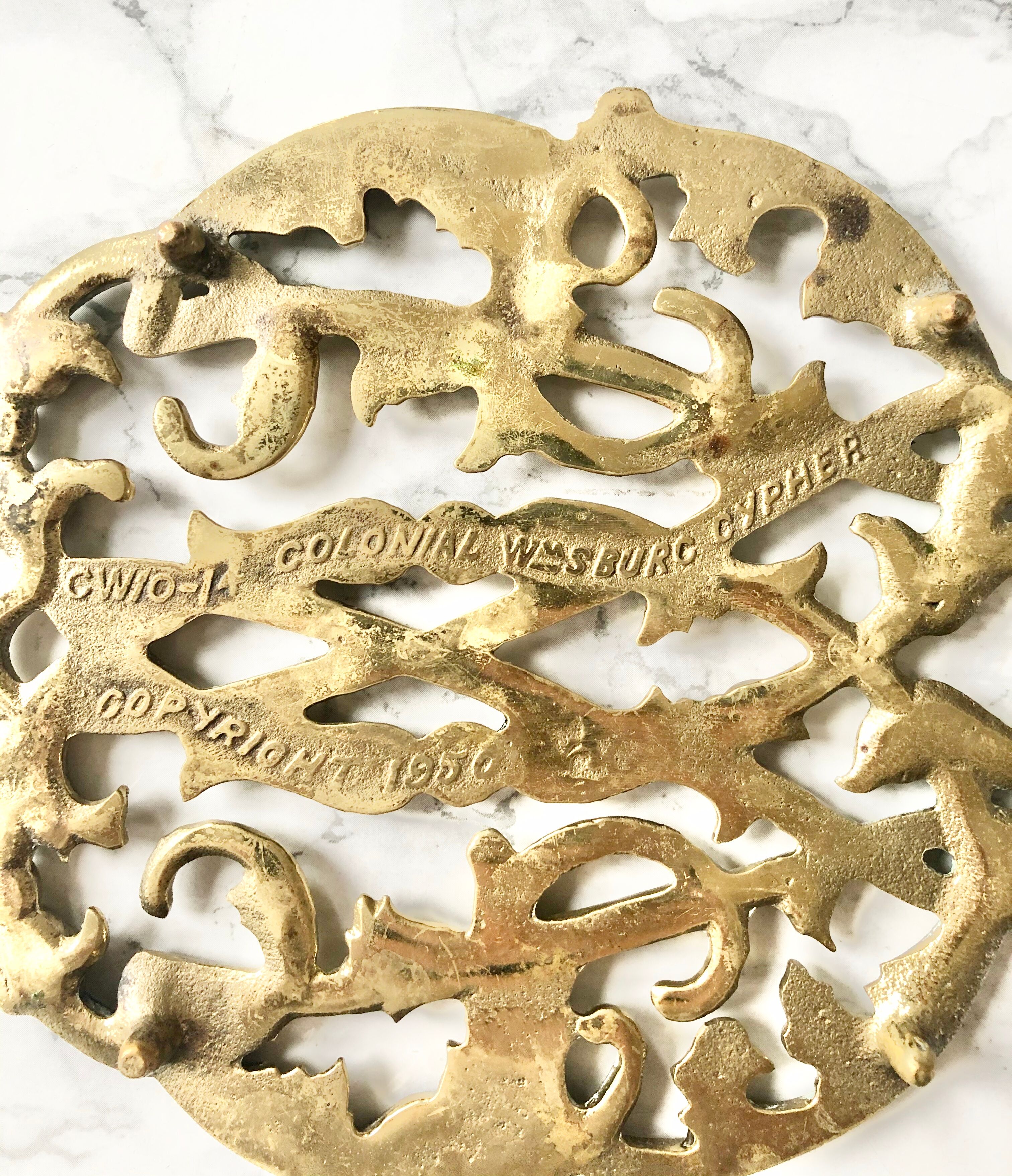 Underside of old solid brass dish, american manufacture Virginia Metalcrafters