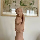 Terracotta sculpture of an entwined couple.