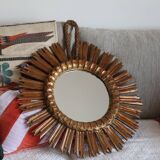 Old large sun mirror in gilded wood
